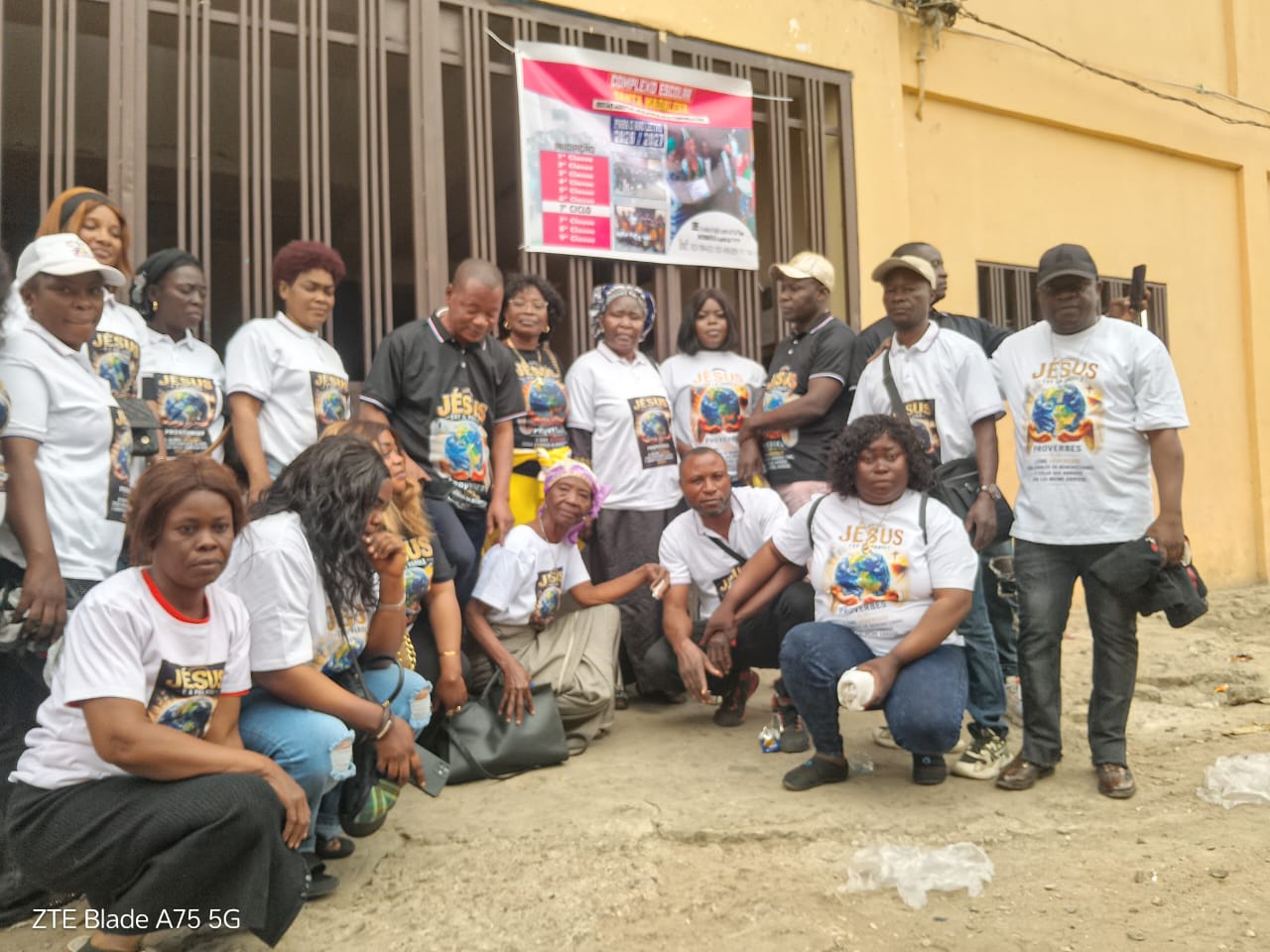 The Jesus is the Word team gathered outside a school after a donation drive